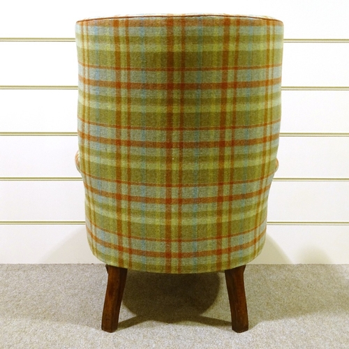 93 - A barrel-back wing armchair, recently re-upholstered in buttoned tartan fabric, with rollover arms a... 