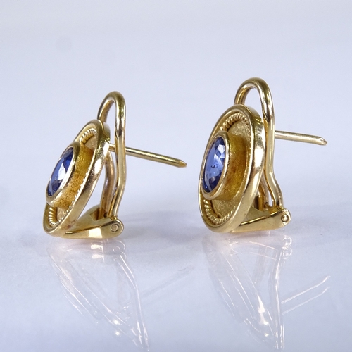 573 - A pair of 18ct gold Ceylon? sapphire clip earrings, textured rope twist frames with post and clip fi... 