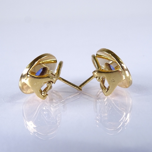 573 - A pair of 18ct gold Ceylon? sapphire clip earrings, textured rope twist frames with post and clip fi... 