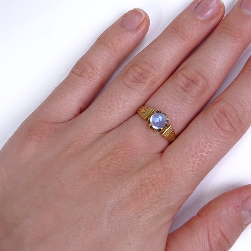 574 - A 19th century unmarked gold high cabochon moonstone dress ring, 8 claw setting with engraved should... 