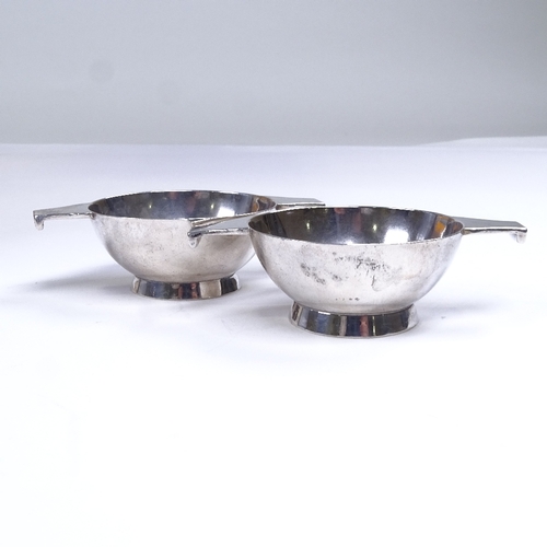 580 - A pair of small provincial silver quaiches, maker's marks H & Co Ltd, length including handles 8cm, ... 