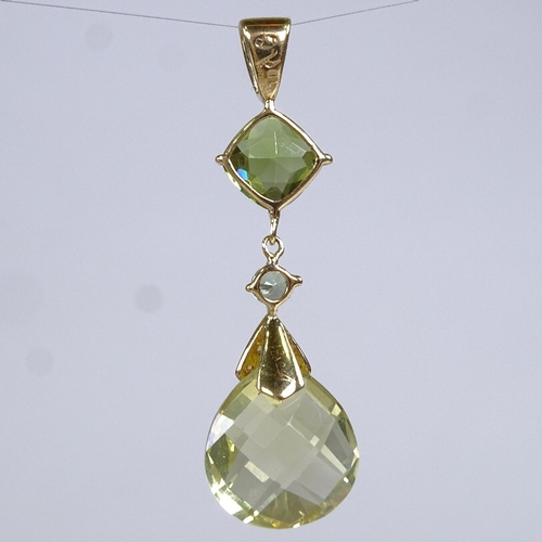 581 - A modern 18ct gold peridot diamond topaz and quartz pendant, pendant height 40.1mm, 2.9g