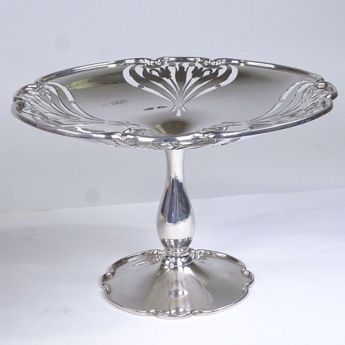 585 - An Edwardian Art Nouveau silver pedestal comport, pierced tulip decoration, by Sibray, Hall & Co Ltd... 