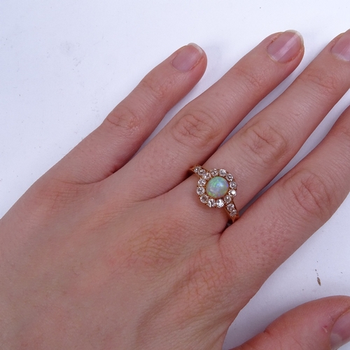 597 - An early 20th century 18ct rose gold cabochon opal and diamond cluster ring, with old-cut diamond sh... 