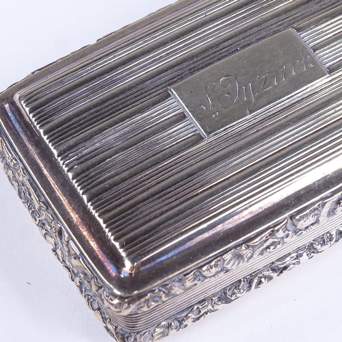 600 - A George IV rectangular silver snuffbox, allover reeded decoration with cast floral border and gilt ... 