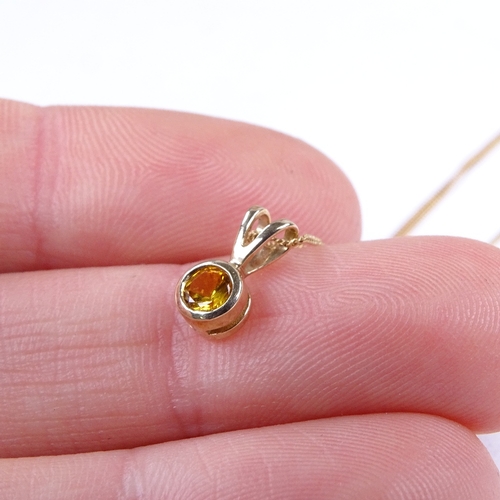 604 - A modern unmarked gold orangy yellow topaz pendant, on 9ct trace link chain, pendant height 9.9mm, c... 