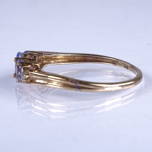 614 - A modern 9ct gold 3-stone tanzanite and diamond dress ring, setting height 4.6mm, size O/P, 1.4g