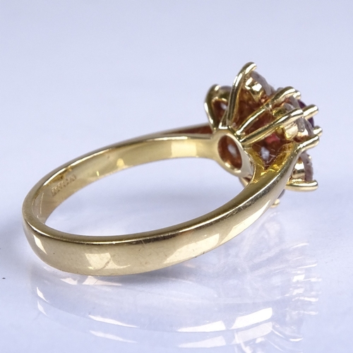 645 - A late 20th century 18ct gold ruby and diamond cluster snowflake dress ring, total diamond content a... 