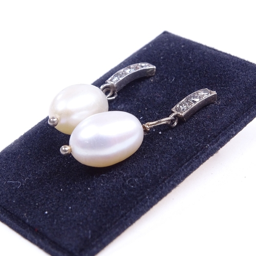 661 - A pair of unmarked gold pearl and diamond drop earrings, total diamond content approx 0.18ct, stud f... 