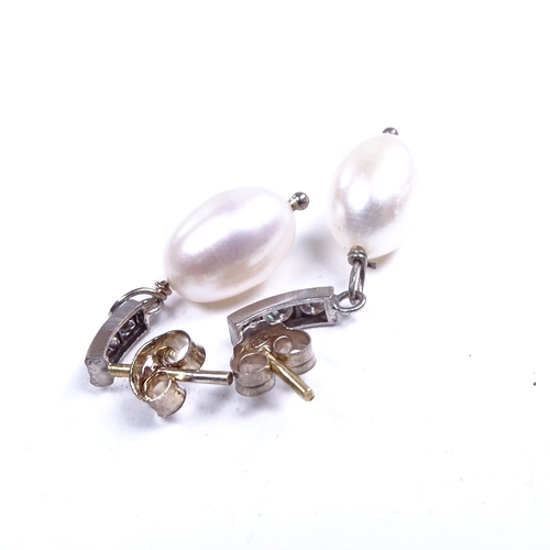 661 - A pair of unmarked gold pearl and diamond drop earrings, total diamond content approx 0.18ct, stud f... 