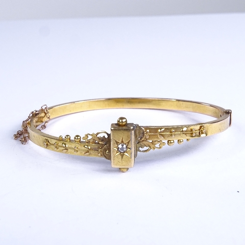 677 - A 19th century 15ct gold and diamond Etruscan hinged bangle, internal length 55mm, internal height 4... 