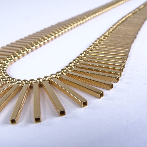 678 - A late 20th century 18ct gold graduated hollow tube link fringe necklace, with double-bead row and t... 