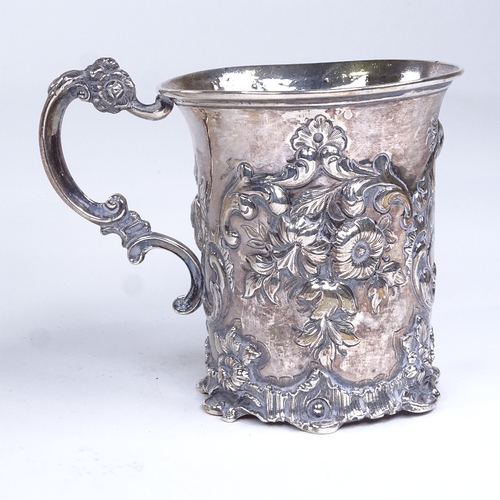 694 - A Victorian silver half pint mug, allover floral and foliate relief embossed decoration, by Thomas E... 