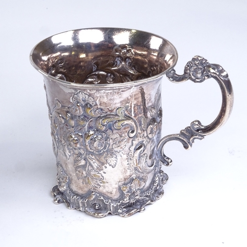 694 - A Victorian silver half pint mug, allover floral and foliate relief embossed decoration, by Thomas E... 