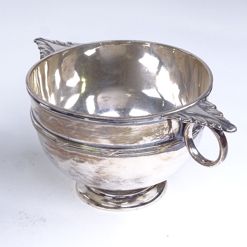 695 - A George V circular silver 2-handled porringer, cast acanthus leaves with cross reeded decoration, b... 