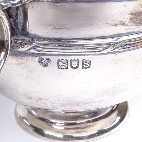 695 - A George V circular silver 2-handled porringer, cast acanthus leaves with cross reeded decoration, b... 