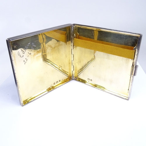 699 - A George V Art Deco square silver cigarette case, allover engine turned decoration, with concealed h... 