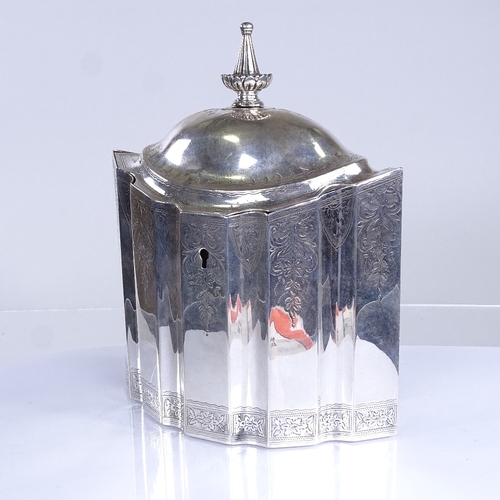 702 - A late Victorian marquise-shaped silver tea caddy, in Georgian style, bright-cut floral engraved swa... 