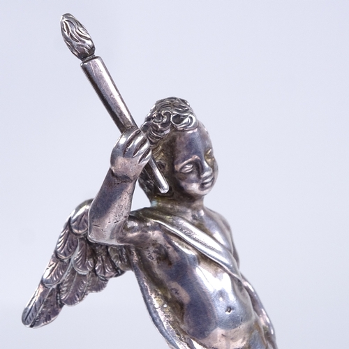 735 - An unmarked cast-silver cherub figure, on modern white marble base, overall height 10cm