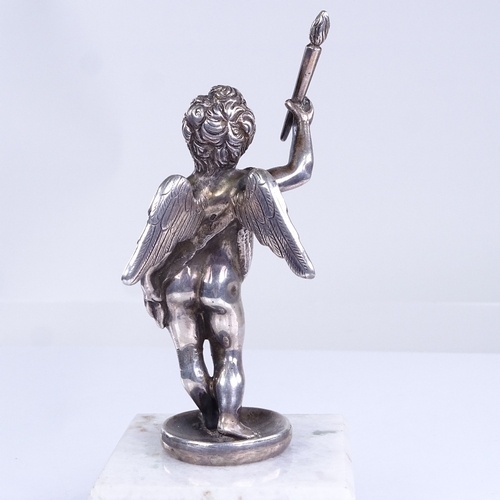 735 - An unmarked cast-silver cherub figure, on modern white marble base, overall height 10cm