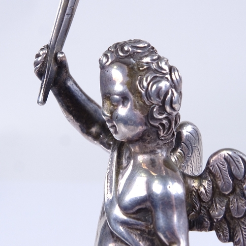 735 - An unmarked cast-silver cherub figure, on modern white marble base, overall height 10cm