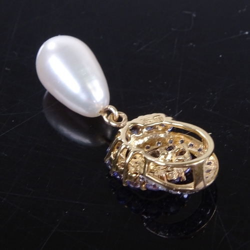 743 - A modern 9ct gold pearl iolite and diamond cluster swirl pendant, pendant height 31.4mm, 2.5g