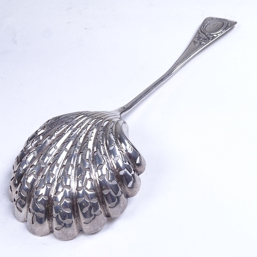 744 - A 19th century French silver sugar sifter spoon, pierced shell-shaped bowl with engraved lattice dec... 