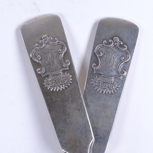 745 - A pair of Antique Russian silver tablespoons, with floral crest, maker's marks AT, length 21.5cm, 5.... 