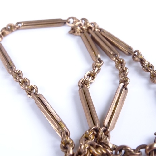 747 - An early 20th century 9ct rose gold fancy link Albert chain necklace, with dog clip and T-bar, chain... 