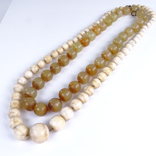 749 - A Chinese nephrite? polished bead necklace, length 56cm, and a 19th century ivory bead necklace, len... 