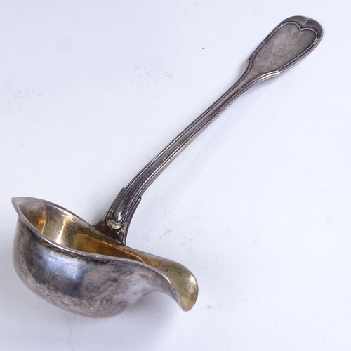 750 - A large 19th century German silver Fiddle pattern punch ladle, a German silver Fiddle pattern sauce ... 