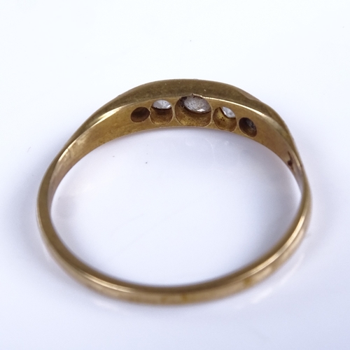 752 - An early 20th century unmarked high carat gold graduated 5-stone diamond half hoop ring, total diamo... 