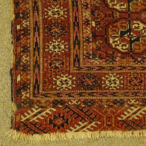 458 - A handmade Caucasian red ground geometric design rug