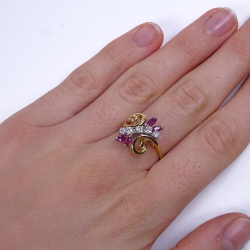 762 - A late 20th century 18ct gold ruby and diamond floral dress ring, total diamond content approx 0.25c... 