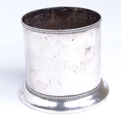 765 - An Edwardian silver cylindrical wine bottle coaster, turned oak base with gadrooned rim, by Barker B... 