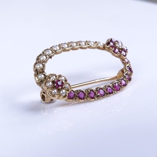 770 - A late 20th century 9ct gold ruby and split pearl floral oval brooch, brooch length 31.2mm, 3.1g