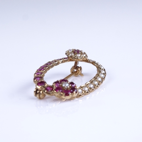 770 - A late 20th century 9ct gold ruby and split pearl floral oval brooch, brooch length 31.2mm, 3.1g