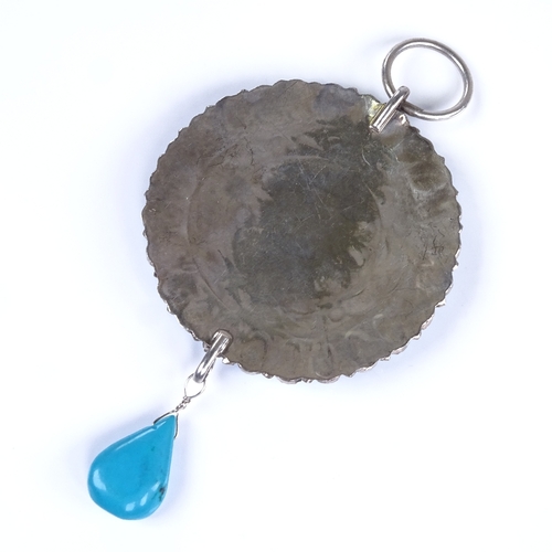 784 - A large Vintage turquoise and unmarked silver circular pendant, possibly Mexican, with pear-shaped t... 