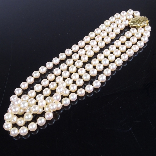 785 - A Vintage triple-strand choker length cultured pearl necklace, on 14ct gold shell clasp, necklace le... 