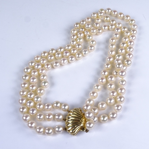 785 - A Vintage triple-strand choker length cultured pearl necklace, on 14ct gold shell clasp, necklace le... 