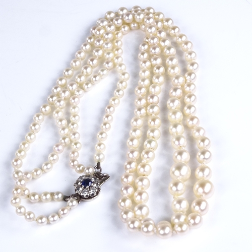 793 - A Vintage graduated double-strand Princess length cultured pearl necklace, on 9ct gold sapphire and ... 