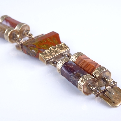 799 - A Victorian Scottish unmarked gold and faceted hardstone panel bracelet, floral engraved mounts enca... 