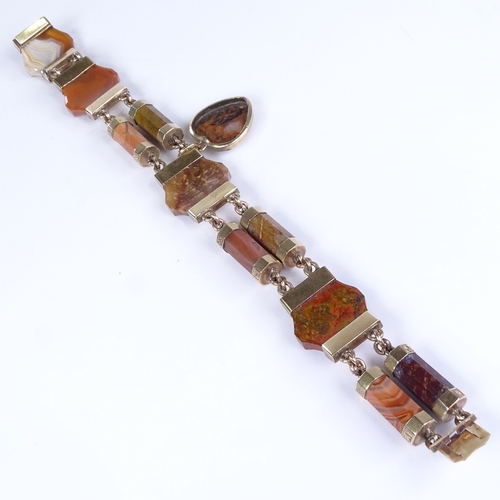 799 - A Victorian Scottish unmarked gold and faceted hardstone panel bracelet, floral engraved mounts enca... 