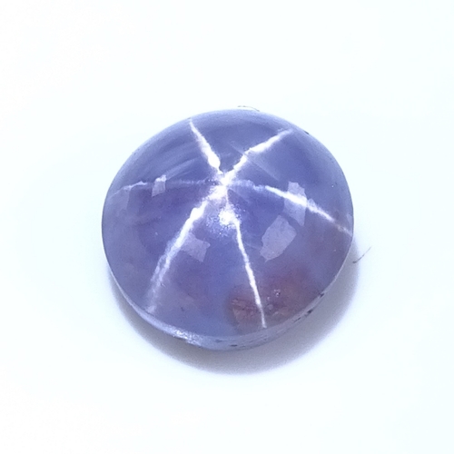 803 - A loose cabochon pale purplish blue 6 rayed star sapphire, diameter - 8.26mm, depth - 6.01mm, 0.87g