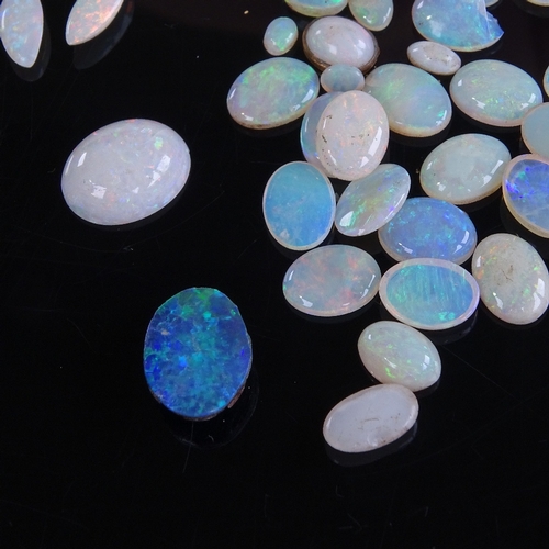 805 - A large quantity of various loose opals, including marquise, cabochons, black opal doublet etc