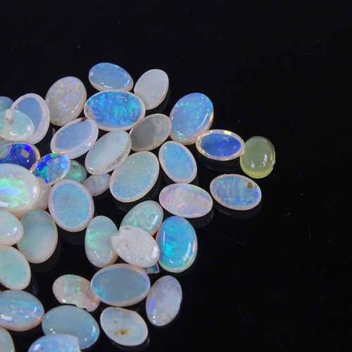 805 - A large quantity of various loose opals, including marquise, cabochons, black opal doublet etc