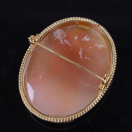 863 - A Vintage relief carved cameo shell panel brooch, depicting female profile, in 9ct gold rope twist f... 