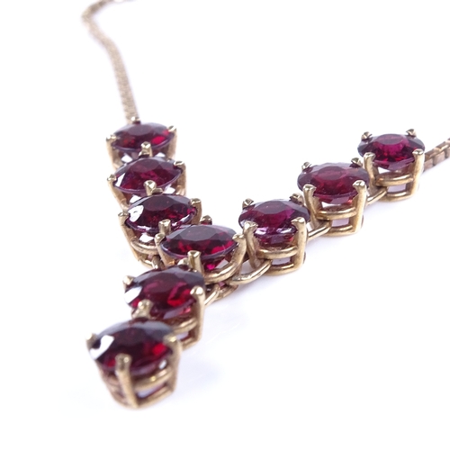 868 - A late 20th century 9ct gold garnet line necklace, on 9ct box link chain, necklace length 40cm, 11.6... 