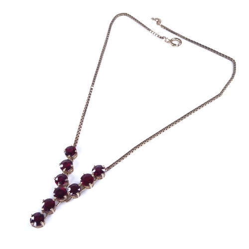 868 - A late 20th century 9ct gold garnet line necklace, on 9ct box link chain, necklace length 40cm, 11.6... 