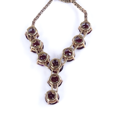 868 - A late 20th century 9ct gold garnet line necklace, on 9ct box link chain, necklace length 40cm, 11.6... 